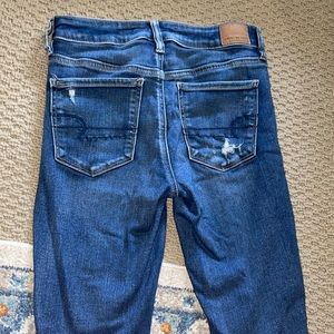 Blue ripped  jeans size 6.